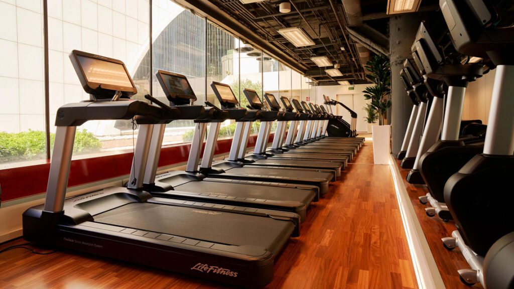 Treadmills placed in a row in a room