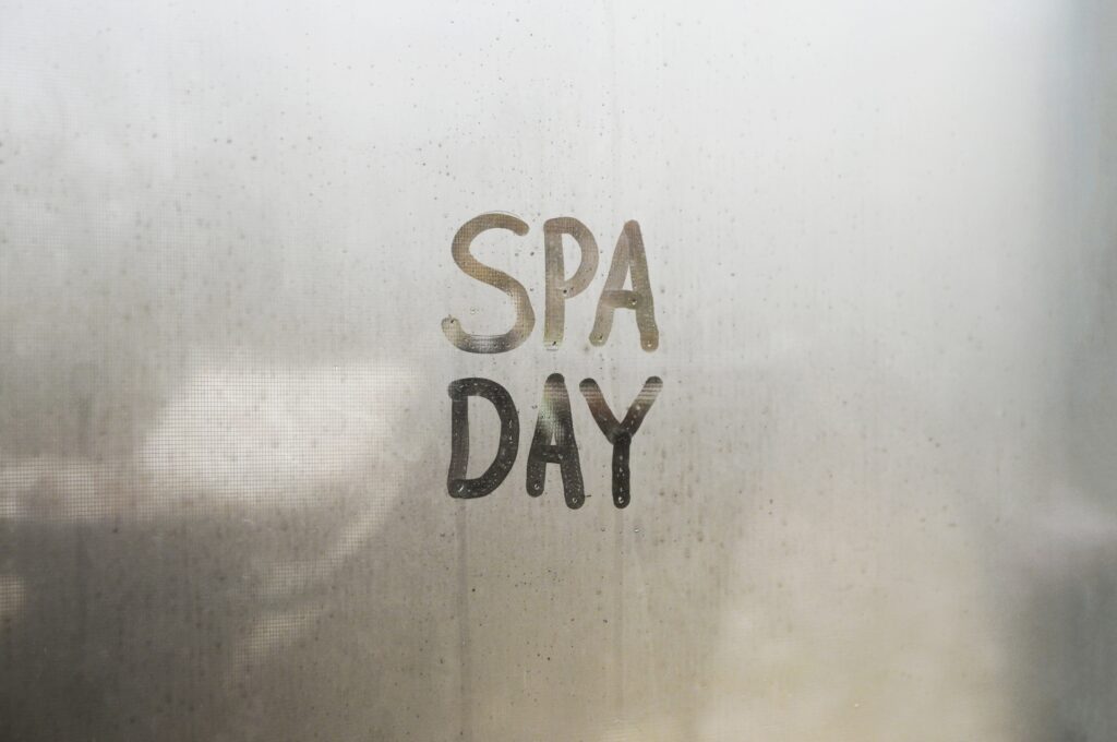 The word spa day is written on a metal door, providing a helpful clue for those wondering how to pick a sauna.